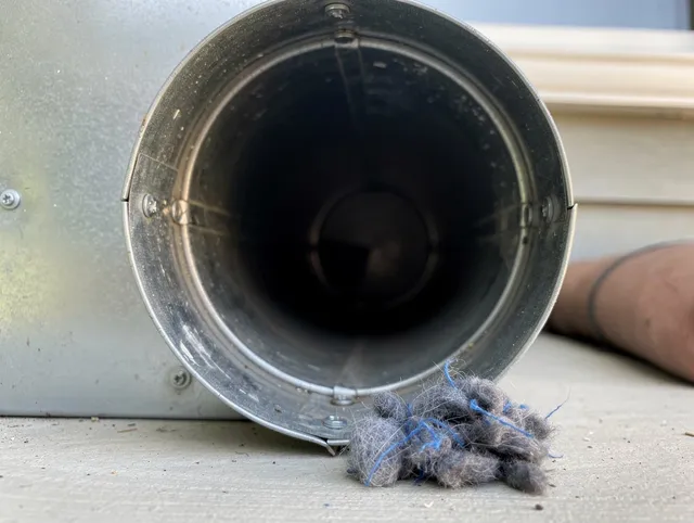 Duarte Dryer Vent Cleaning technician using specialized equipment to clear severe dryer vent blockage in Duarte
